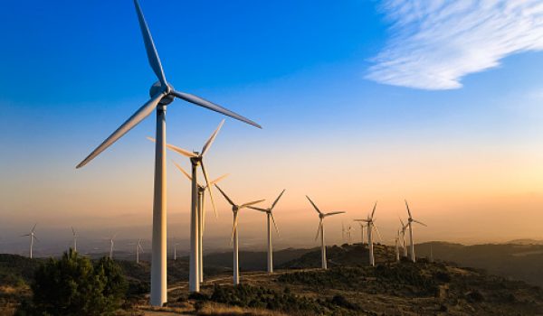 Wind farm in Navarre, Spain at sunset. Renewable energy concept.
